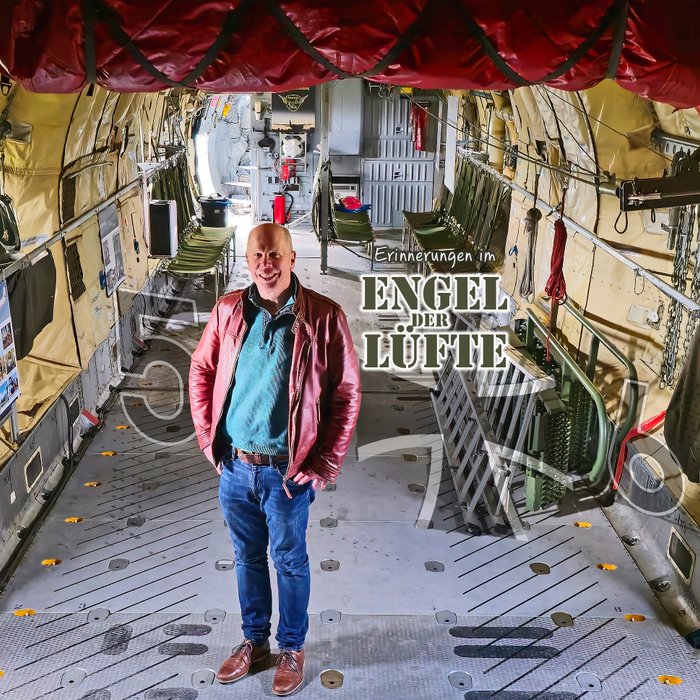 Titelmotiv der Geschichte über die Transall, auf dem Achim Figgen unter dem Fallschirm steht